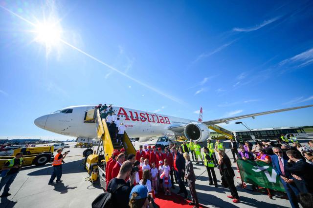 Members of Austria's national football team board a plane before departing from the Schwechat airport near Vienna, Austria, on June 4, 2026, ahead of the FIFA 2026 World Cup. (Photo by MAX SLOVENCIK / APA / AFP) / Austria OUT