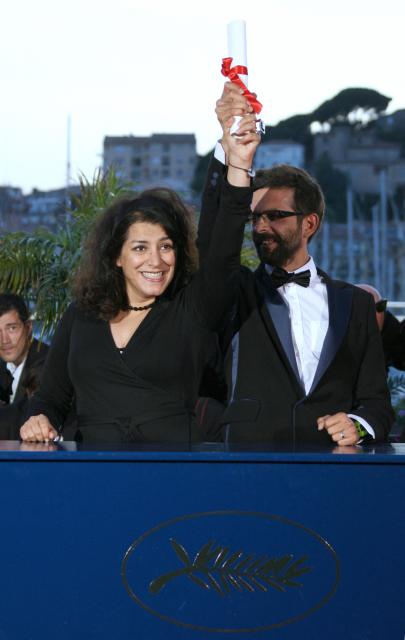 (FILES) Iranian cartoonist Marjane Satrapi (R) and French director Vincent Paronnaud celebrate 27 May 2007 during a photocall after equally winning with Mexican director Carlos Reygadas (not in the picture) the Grand Jury prize for their animated film 'Persepolis' during a photocall at the 60th edition of the Cannes Film Festival at the Festival Palace in Cannes, southern France. The Franco-Iranian artist Marjane Satrapi, who gained worldwide recognition with the graphic novel and film "Persepolis," has died at the age of 56, AFP learned on June 4, 2026 from her relatives. (Photo by ANNE-CHRISTINE POUJOULAT / AFP)