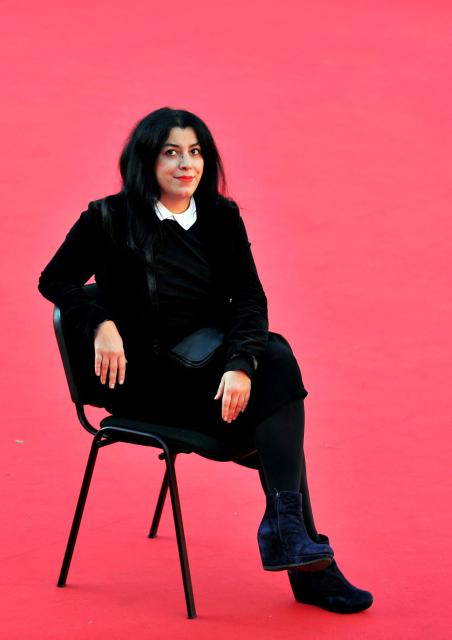 (FILES) Iranian writer and film director Marjane Satrapi poses during the photocall of her latest film "La bande des Jotas" (Gang of the Jotas) in Rome, on November 16, 2012 during the seventh edition of the Rome film festival. The Franco-Iranian artist Marjane Satrapi, who gained worldwide recognition with the graphic novel and film "Persepolis," has died at the age of 56, AFP learned on June 4, 2026 from her relatives. (Photo by TIZIANA FABI / AFP)