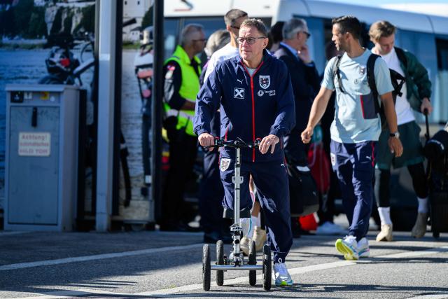 Austria's national football team coach Ralf Rangnick arrives to board a plane before the team departed from the Schwechat airport near Vienna, Austria, on June 4, 2026, ahead of the FIFA 2026 World Cup. (Photo by MAX SLOVENCIK / APA / AFP) / Austria OUT