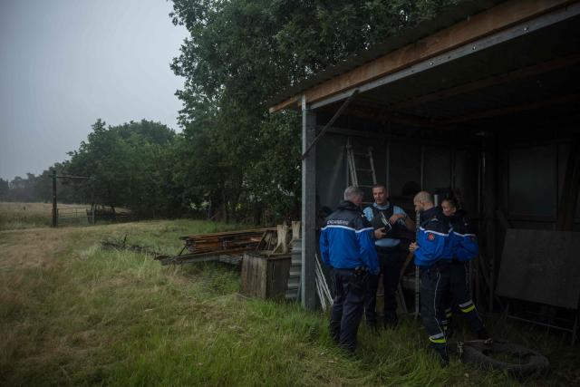 Police officers gather as they prepare to continue the search for 11-year-old Lyhanna who went missing on May 29 after getting into a man's car in front of her middle school in the town of Fleurance, west of Toulouse, on June 4, 2026. A 41 year-old suspect, father of one of Lyhanna's friends, who, prior to her disappearance, had been the subject of several reports and complaints, notably for the rape of a minor, was formally charged on June 1 with kidnapping and false imprisonment, and placed in custody. (Photo by Ed JONES / AFP)