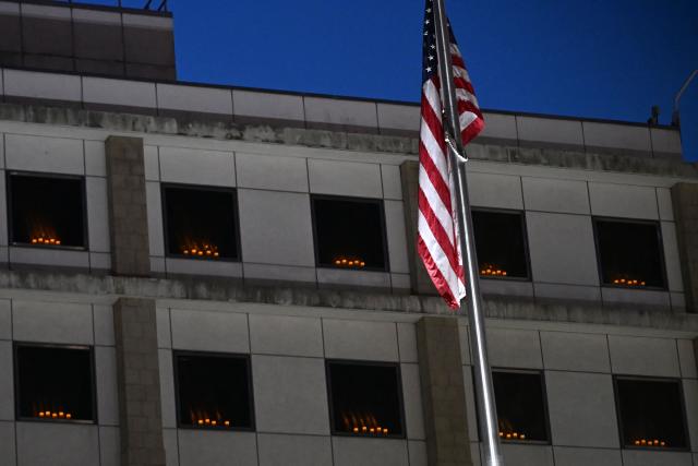 Candles are seen in the windows of the US consulate in Hong Kong on June 4, 2026, to mourn the victims of China's Tiananmen Square crackdown on June 4, 1989, as vigils to mark the date have been banned in the city due to a national security law in 2020. (Photo by Peter PARKS / AFP)