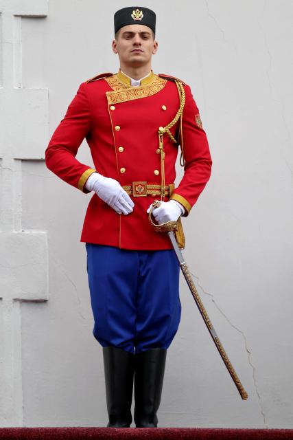 A soldier stands guard at the front door of the Blue Palace prior to a welcome ceremony for France's President as part of his first official visit to Montenegro ahead of the EU-Western Balkans Summit, in Cetinje on June 4, 2026. (Photo by Ludovic MARIN / AFP)