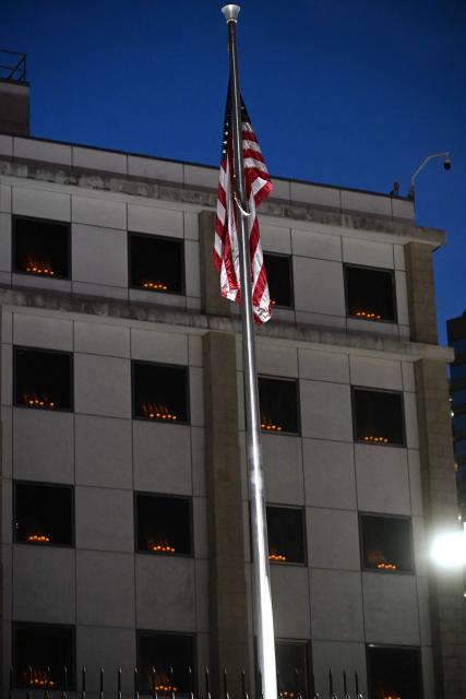 Candles are seen in the windows of the US consulate in Hong Kong on June 4, 2026, to mourn the victims of China's Tiananmen Square crackdown on June 4, 1989, as vigils to mark the date have been banned in the city due to a national security law in 2020. (Photo by Peter PARKS / AFP)