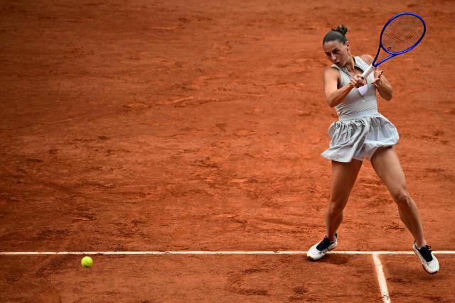 Ukraine's Marta Kostyuk plays a forehand return to Mirra Andreeva during their women's semi final singles match on day 12 of the French Open tennis tournament on Court Philippe-Chatrier at the Roland-Garros Complex in Paris on June 4, 2026. (Photo by JULIEN DE ROSA / AFP)
