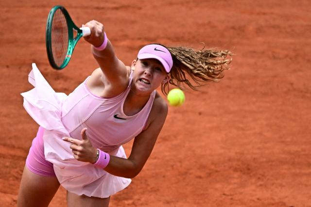 Mirra Andreeva serves to Ukraine's Marta Kostyuk during their women's semi final singles match on day 12 of the French Open tennis tournament on Court Philippe-Chatrier at the Roland-Garros Complex in Paris on June 4, 2026. (Photo by JULIEN DE ROSA / AFP)