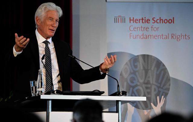 US actor, founder and Co-Chair of the Gere Foundation Richard Gere gives a speech at the Hertie School Centre for Fundamental Rights at a joint launch of an Initiative on Migration in Berlin on June 4, 2026. (Photo by Tobias SCHWARZ / AFP)