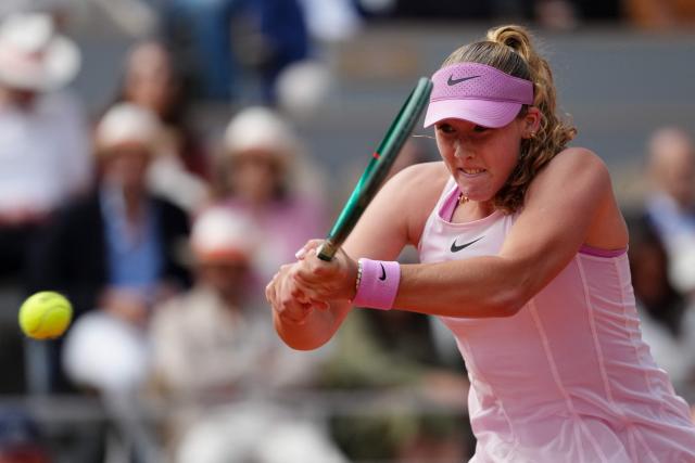 Mirra Andreeva plays a backhand return to Ukraine's Marta Kostyuk during their women's semi final singles match on day 12 of the French Open tennis tournament on Court Philippe-Chatrier at the Roland-Garros Complex in Paris on June 4, 2026. (Photo by Dimitar DILKOFF / AFP)