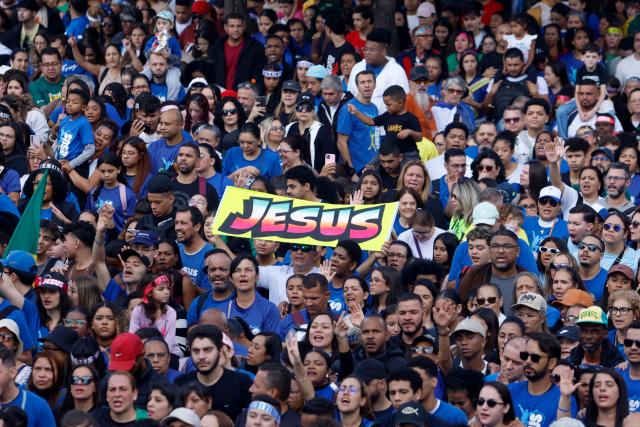 People take part in the "March for Jesus", an event that gathers a wide range of evangelical congregations, in Sao Paulo, Brazil on June 4, 2026. (Photo by Miguel SCHINCARIOL / AFP)