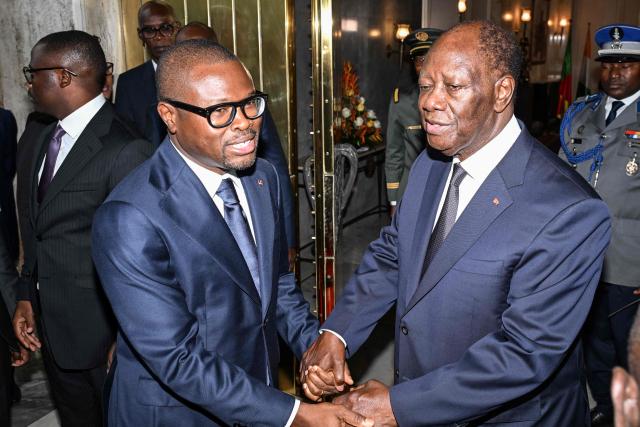 Ivory Coast's president Alassane Ouattara (R) shakes hands with the newly elected president of Benin Romuald Wadagni (C-L) after their meeting at the presidential palace in Abidjan on June 4, 2026. (Photo by Issouf SANOGO / AFP)