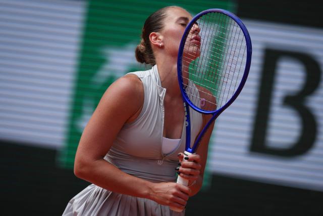 Ukraine's Marta Kostyuk reacts to a point against Mirra Andreeva during their women's semi final singles match on day 12 of the French Open tennis tournament on Court Philippe-Chatrier at the Roland-Garros Complex in Paris on June 4, 2026. (Photo by Dimitar DILKOFF / AFP)