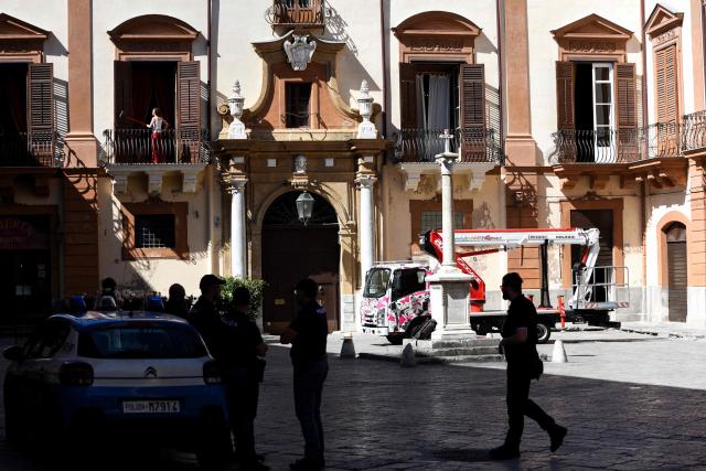 Police officers stand outside Palazzo Valguarnera Gangi as preparations are underway for the wedding celebrations of British singer Dua Lipa and British actor Callum Turner in Palermo, Sicily, on June 4, 2026. The couple, who married in a civil ceremony in London on May 31, are set to celebrate with guests from June 5 to 7 across several Palermo venues, with the main event to be held at Villa Valguarnera in nearby Bagheria. (Photo by ALESSANDRO FUCARINI / AFP)