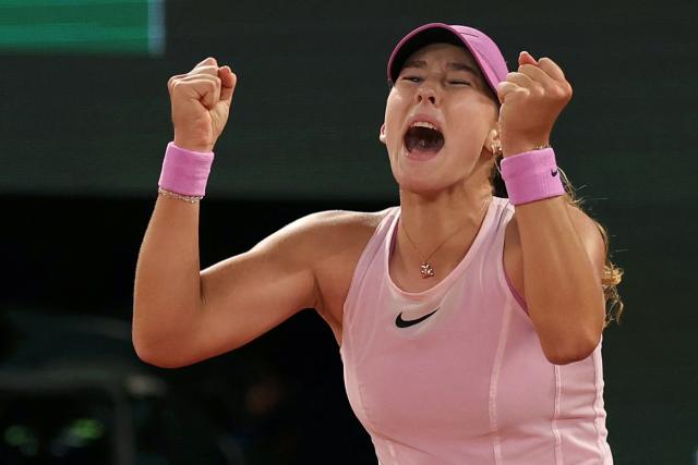 Mirra Andreeva celebrates her victory at the end of her women's semi final singles match against Ukraine's Marta Kostyuk on day 12 of the French Open tennis tournament on Court Philippe-Chatrier at the Roland-Garros Complex in Paris on June 4, 2026. (Photo by Thomas SAMSON / AFP)