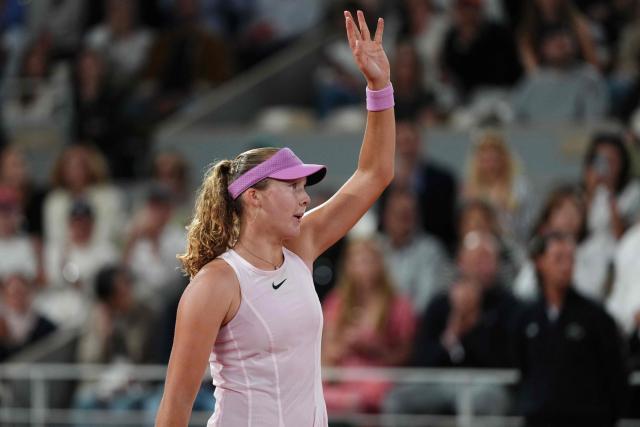 Mirra Andreeva celebrates her victory at the end of her women's semi final singles match against Ukraine's Marta Kostyuk on day 12 of the French Open tennis tournament on Court Philippe-Chatrier at the Roland-Garros Complex in Paris on June 4, 2026. (Photo by Dimitar DILKOFF / AFP)