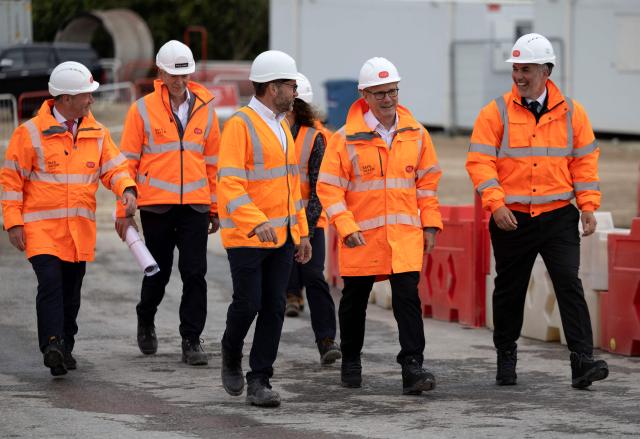 Britain's Prime Minister Keir Starmer (2R), wearing a high-vis jacket and hard hat, and flanked by Britain's Housing Secretary Steve Reed (L) and Mayor of York and North Yorkshire David Skaithe (R), visits  York Central construction site in York, northern England on June 4, 2026. (Photo by James Glossop / POOL / AFP)