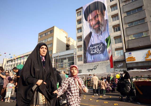 Iranians take part during a rally in support of the country's supreme leader Mojtaba Khamenei as they celebrate the Eid al-Ghadir in Tehran on June 4, 2026. Eid al-Ghadir commemorates the events of Ghadir al-Khumm during which Shiites believe that the Prophet Mohammed appointed Ali ibn Abi Talib, his cousin and son-in-law who was among the first Muslims, as his successor. (Photo by AFP) / 