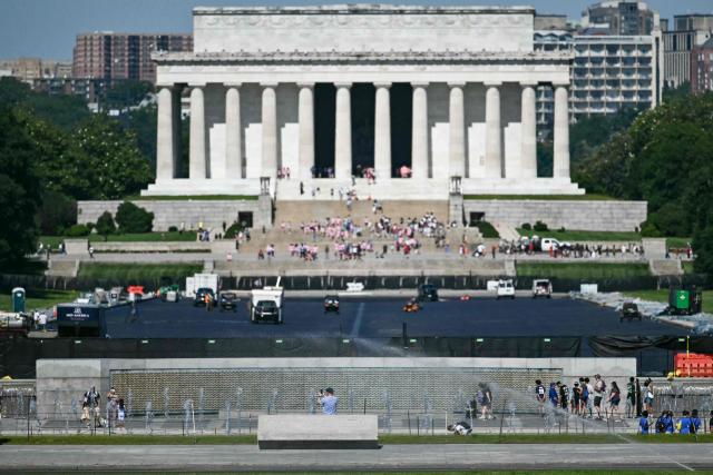 Contractors continue work on the Reflecting Pool on the National Mall in Washington, DC, on June 4, 2026. US President Donald Trump has ordered the long basin, designed to capture reflections of the towering Washington obelisk on the Mall, to be drained and painted in what he calls "American flag blue." It is expected to reopen before the July 4 holiday, which will also mark the 250th anniversary of US independence. (Photo by Kent NISHIMURA / AFP)