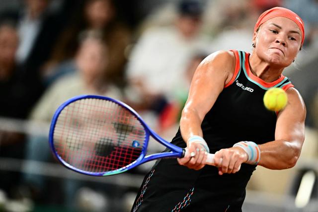 Russia's Diana Shnaider plays a backhand return to Poland's Maja Chwalinska during their women's semi final singles match on day 12 of the French Open tennis tournament on Court Philippe-Chatrier at the Roland-Garros Complex in Paris on June 4, 2026. (Photo by JULIEN DE ROSA / AFP)