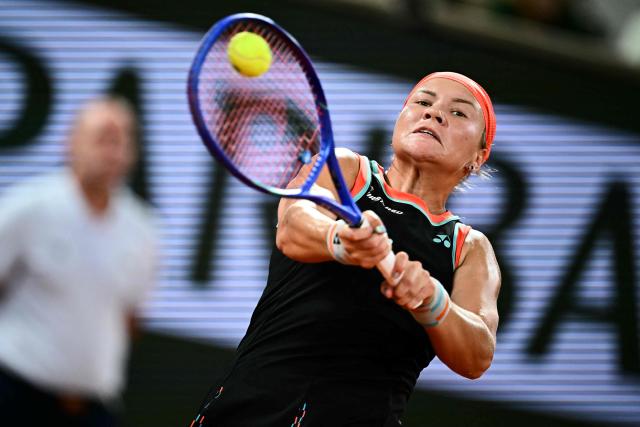 Russia's Diana Shnaider plays a backhand return to Poland's Maja Chwalinska during their women's semi final singles match on day 12 of the French Open tennis tournament on Court Philippe-Chatrier at the Roland-Garros Complex in Paris on June 4, 2026. (Photo by JULIEN DE ROSA / AFP)