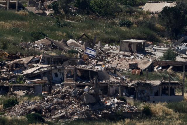 An Israeli flag held on top of a destroyed building in the southern Lebanese village of Kfar Kela near the border is pictured from the Upper Galilee in northern Israel, on June 4, 2026. Lebanese Prime Minister Nawaf Salam said on June 4 that the army would begin deploying in "pilot zones" in the country's south, a day after Israel and Lebanon agreed in Washington to implement a ceasefire (Photo by Jalaa MAREY / AFP)