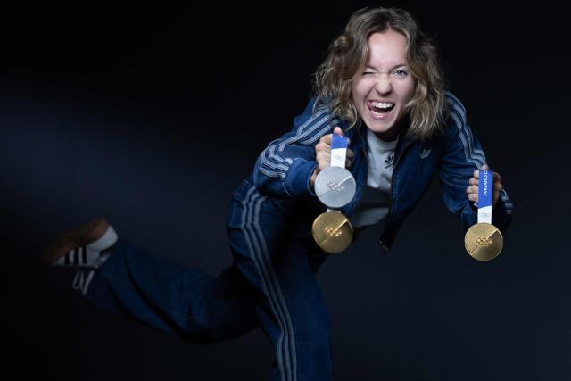 French biathlete Oceane Michelon, poses with the three medals, she won at the Milan Winter Olympic (gold for the 12.5 km mass start and the 4x6km relay and silver for the 7.5km sprint) during a photo session in Paris on June 4, 2026. (Photo by Joel Saget / AFP)