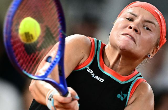 Russia's Diana Shnaider plays a backhand return to Poland's Maja Chwalinska during their women's semi final singles match on day 12 of the French Open tennis tournament on Court Philippe-Chatrier at the Roland-Garros Complex in Paris on June 4, 2026. (Photo by JULIEN DE ROSA / AFP)
