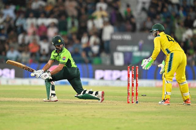 Pakistani's Ghazi Ghori is bowled by Matthew Kuhnemann during the third one-day international (ODI) cricket match between Pakistan and Australia at Gaddafi Stadium in Lahore on June 4, 2026. (Photo by Arif ALI / AFP)