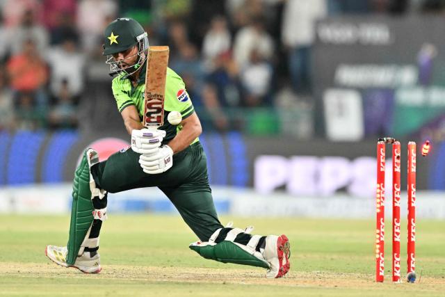 Pakistani's Ghazi Ghori is bowled by Matthew Kuhnemann during the third one-day international (ODI) cricket match between Pakistan and Australia at Gaddafi Stadium in Lahore on June 4, 2026. (Photo by Arif ALI / AFP)