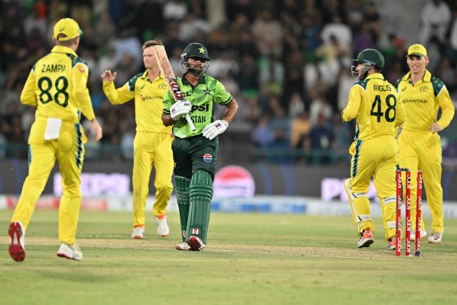 Pakistani's Ghazi Ghori is bowled by Matthew Kuhnemann during the third one-day international (ODI) cricket match between Pakistan and Australia at Gaddafi Stadium in Lahore on June 4, 2026. (Photo by Arif ALI / AFP)