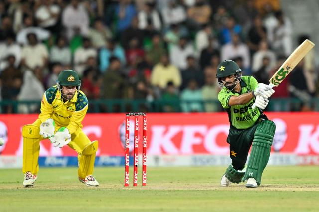 Pakistan's Babar Azam (R) plays a shot during the third one-day international (ODI) cricket match between Pakistan and Australia at Gaddafi Stadium in Lahore on June 4, 2026. (Photo by Arif ALI / AFP)