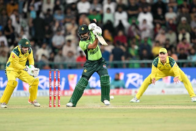 Pakistan's Babar Azam (C) plays a shot during the third one-day international (ODI) cricket match between Pakistan and Australia at Gaddafi Stadium in Lahore on June 4, 2026. (Photo by Arif ALI / AFP)