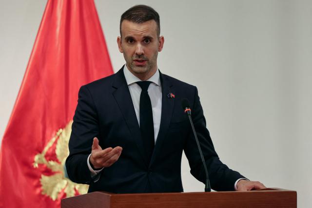 Montenegro's Prime Minister Milojko Spajic delivers a statement flanked by France's President following a signing ceremony during Macron's first official visit to Montenegro in Cetinje on June 4, 2026. (Photo by Ludovic MARIN / AFP)