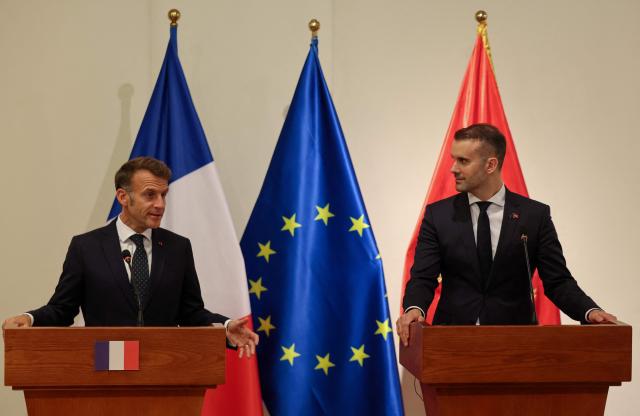 France's President Emmanuel Macron (L) and Montenegro's Prime Minister Milojko Spajic deliver a statement following a signing ceremony during Macron's first official visit to Montenegro in Cetinje on June 4, 2026. (Photo by Ludovic MARIN / AFP)