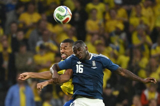 Greece's forward #16 Andreas Tetteh (front R) and Sweden's defender #04 Isak Hien jump to head the ball during the friendly match between Sweden and Greece ahead of the 2026 FIFA World Cup football tournament, in Solna, near Stockholm, on June 4, 2026. (Photo by Jonathan Nackstrand / AFP)