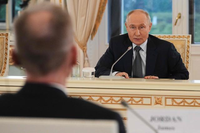 Russian President Vladimir Putin answers to a question by The Associated Press News Director of Europe/Africa James Jordan during a meeting with representatives of international news agencies on the sidelines of the St. Petersburg International Economic Forum at the Constantine Palace in Saint Petersburg on June 4, 2026. (Photo by Dmitry LOVETSKY / POOL / AFP)