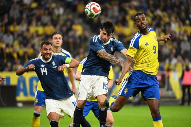 Sweden's forward #09 Alexander Isak (R) vies for the ball with Greece's defender #15 Lazaros Rota (C) and Greece's forward #14 Vangelis Pavlidis during the friendly match between Sweden and Greece ahead of the 2026 FIFA World Cup football tournament, in Solna, near Stockholm, on June 4, 2026. (Photo by Jonathan Nackstrand / AFP)