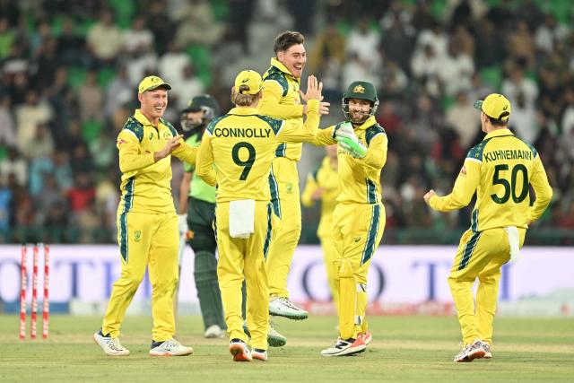 Australia's players celebrate after taking the wicket of Pakistan's Arafat Minhas during the third one-day international (ODI) cricket match between Pakistan and Australia at Gaddafi Stadium in Lahore on June 4, 2026. (Photo by Arif ALI / AFP)