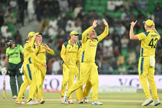 Australia's players celebrate after taking the wicket of Pakistan's Arafat Minhas during the third one-day international (ODI) cricket match between Pakistan and Australia at Gaddafi Stadium in Lahore on June 4, 2026. (Photo by Arif ALI / AFP)