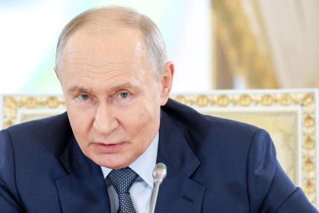 In this pool photograph distributed by the Russian state agency Sputnik, Russia's President Vladimir Putin meets with representatives of international news agencies on the sidelines of the St. Petersburg International Economic Forum at the Constantine Palace in Saint Petersburg on June 4, 2026. (Photo by Alexander KAZAKOV / POOL / AFP)