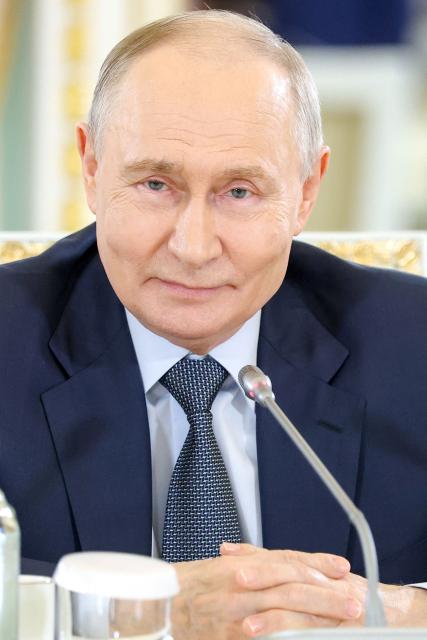In this pool photograph distributed by the Russian state agency Sputnik, Russia's President Vladimir Putin meets with representatives of international news agencies on the sidelines of the St. Petersburg International Economic Forum at the Constantine Palace in Saint Petersburg on June 4, 2026. (Photo by Valery SHARIFULIN / POOL / AFP)