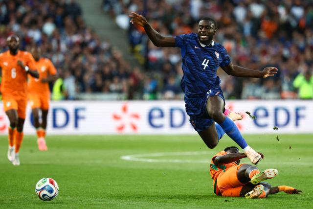 France's defender #04 Dayot Upamecano (top) is tackled by Ivory Coast's forward #14 Oumar Diakite during the international friendly football match between France and Ivory Coast ahead of the 2026 FIFA World Cup football tournament at the Stade de la Beaujoire in Nantes, western France, on June 4, 2026. (Photo by FRANCK FIFE / AFP)
