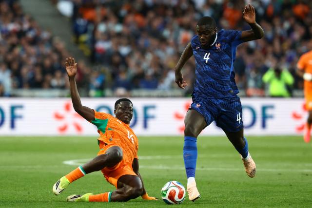 France's defender #04 Dayot Upamecano (R) is tackled by Ivory Coast's forward #14 Oumar Diakite during the international friendly football match between France and Ivory Coast ahead of the 2026 FIFA World Cup football tournament at the Stade de la Beaujoire in Nantes, western France, on June 4, 2026. (Photo by FRANCK FIFE / AFP)