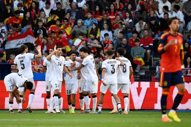 Iraq's defender #23 Merchas Doski celebrates scoring an equalizing goal during the international friendly football match between Spain and Iraq ahead of the 2026 FIFA World Cup football tournament, at the Riazor stadium in A Coruna, northern Spain, on June 4, 2026. (Photo by Ander Gillenea / AFP)
