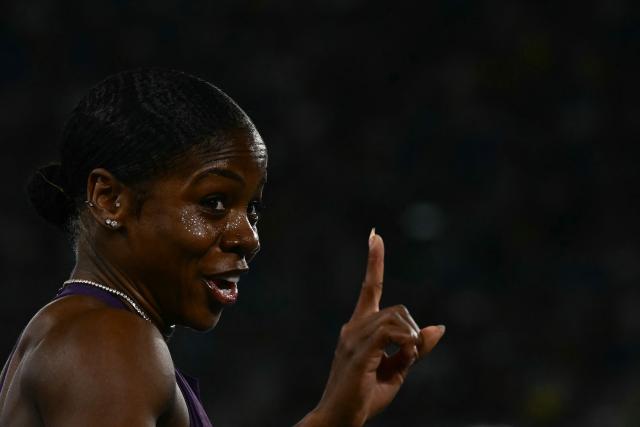 Jamaica's Megan Simmonds celebrates after winning the women's 100m Hurdles during the IAAF Diamond League athletics meeting, at the Olympic Stadium, in Rome on June 4, 2026. (Photo by Filippo MONTEFORTE / AFP)