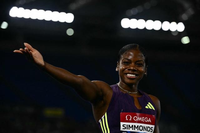 Jamaica's Megan Simmonds celebrates after winning the women's 100m Hurdles during the IAAF Diamond League athletics meeting, at the Olympic Stadium, in Rome on June 4, 2026. (Photo by Filippo MONTEFORTE / AFP)