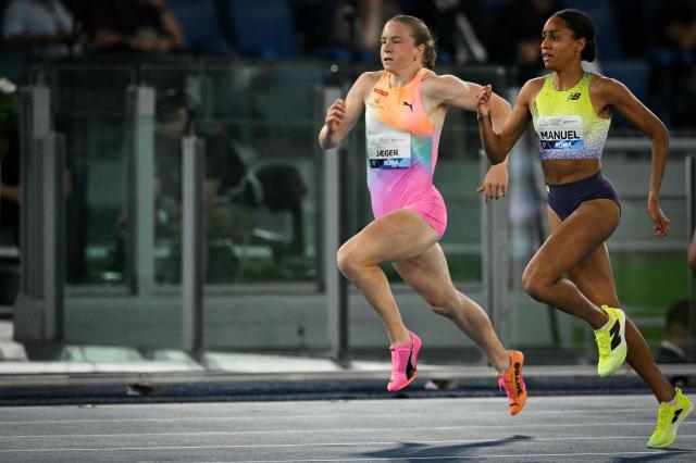Winner Norway's Henriette Jaegger (rear L) and second-placed Czech Republic's Lurdes Gloria Manuel (front R) compete in the women's 400m during the IAAF Diamond League athletics meeting, at the Olympic Stadium, in Rome on June 4, 2026. (Photo by Andreas SOLARO / AFP)