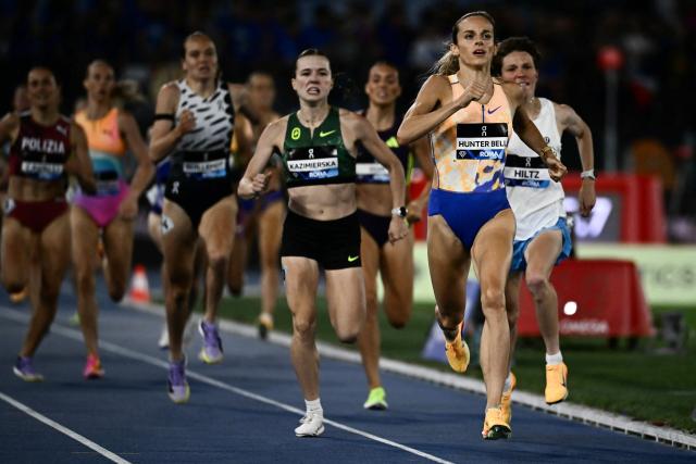 Britain's Georgia Hunter Bell (R) reacts as she crosses the finish line to win the Women's 1500m during the IAAF Diamond League athletics meeting, at the Olympic Stadium, in Rome on June 4, 2026. (Photo by Filippo MONTEFORTE / AFP)