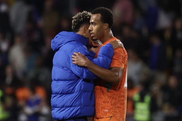 France's forward #20 Desire Doue (L) speaks with Ivory Coast's defender #17 Guela Doue (R) after the international friendly football match between France and Ivory Coast ahead of the 2026 FIFA World Cup football tournament at the Stade de la Beaujoire in Nantes, western France, on June 4, 2026. (Photo by FRANCK FIFE / AFP)
