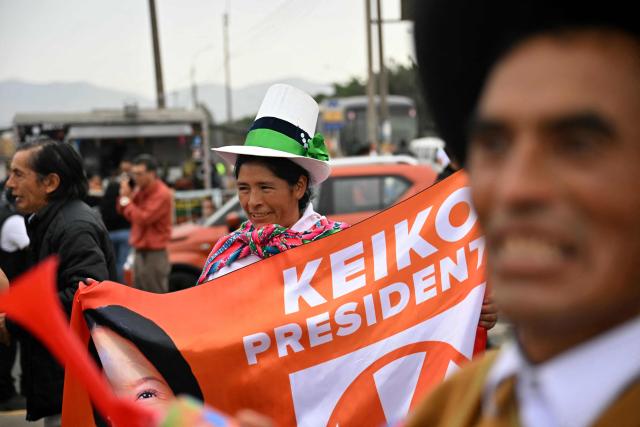 A supporter of Peru's presidential candidate for the Fuerza Popular party, Keiko Fujimori, smiles as she waits for her arrival at a closing campaign rally in Lima on June 4, 2026. Right-wing candidate Keiko Fujimori and leftist Roberto Sanchez will face off in Peru's presidential runoff on June 7, 2026. (Photo by MARTIN BERNETTI / AFP)