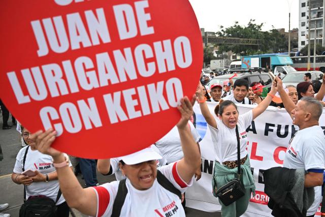 Supporters of Peru's presidential candidate for the Fuerza Popular party, Keiko Fujimori, chant slogans as they wait for her arrival at a closing campaign rally in Lima on June 4, 2026. Right-wing candidate Keiko Fujimori and leftist Roberto Sanchez will face off in Peru's presidential runoff on June 7, 2026. (Photo by MARTIN BERNETTI / AFP)